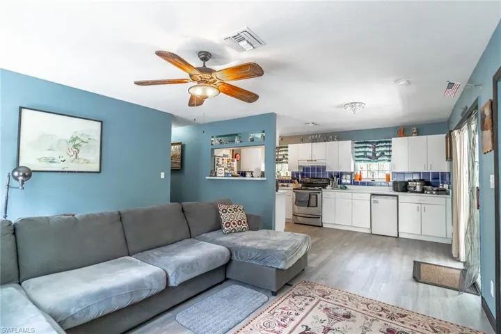 Living area with LVP floors and ceiling fan