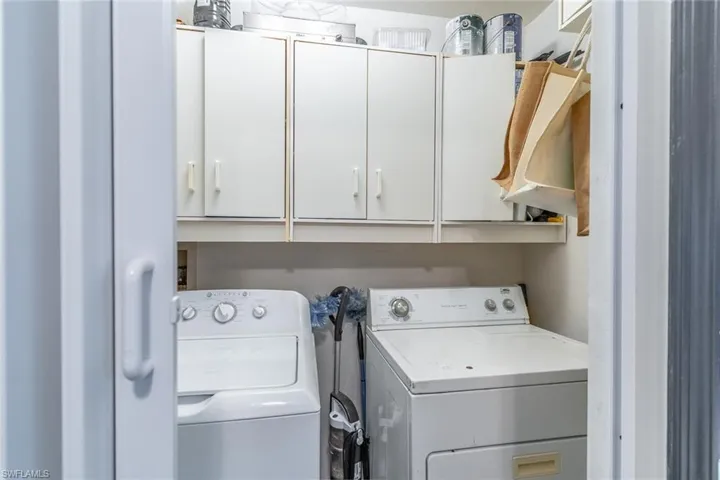 Laundry room with cabinet space and separate washer and dryer