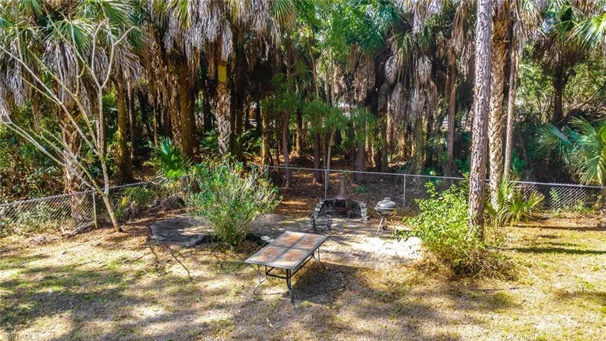 Fenced backyard with a patio