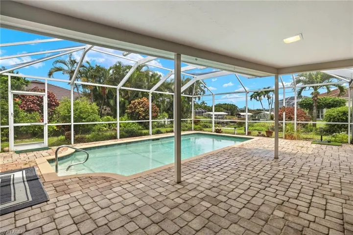 Swimming pool with a patio area and a lanai