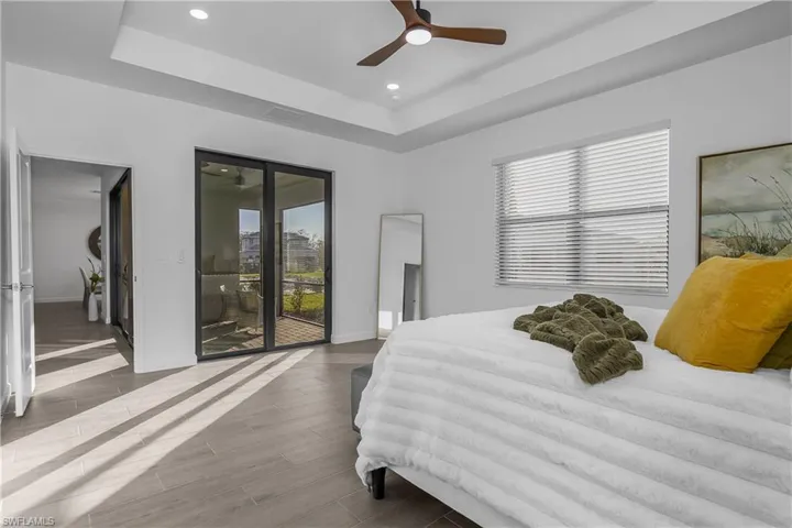 Primary bedroom with added lighting and ensuite oversized bath.