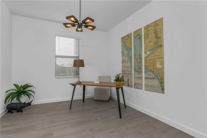 French doors leading to spacious home office/den.