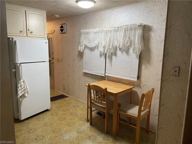 Dining space with light tile floors