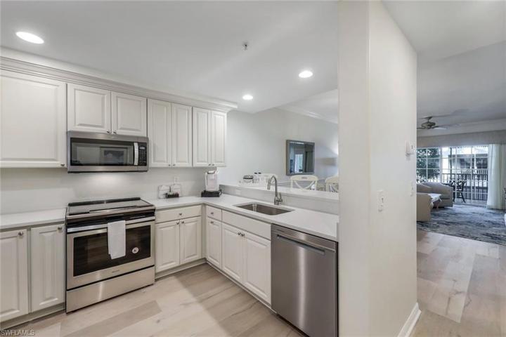 Coastal white kitchen with stainless steel appliances