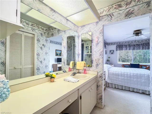 Bathroom featuring vanity and ceiling fan
