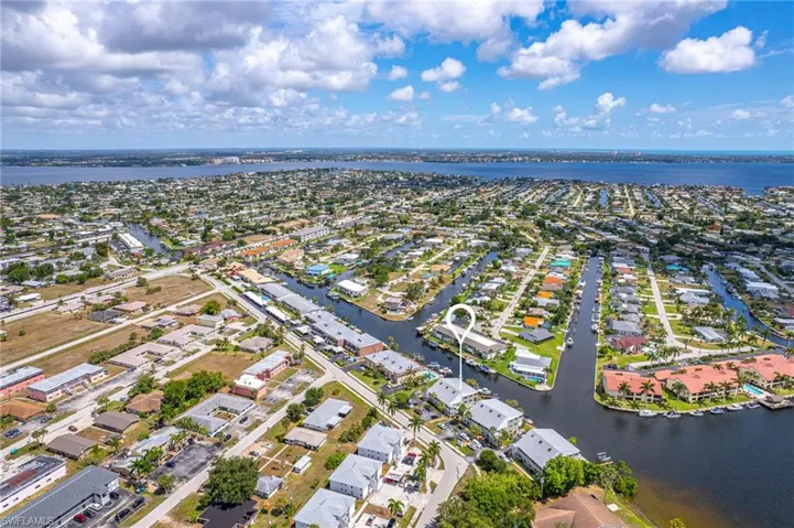 Birds eye view of property featuring a residential view and a water view