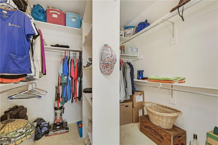 Walk in closet featuring carpet