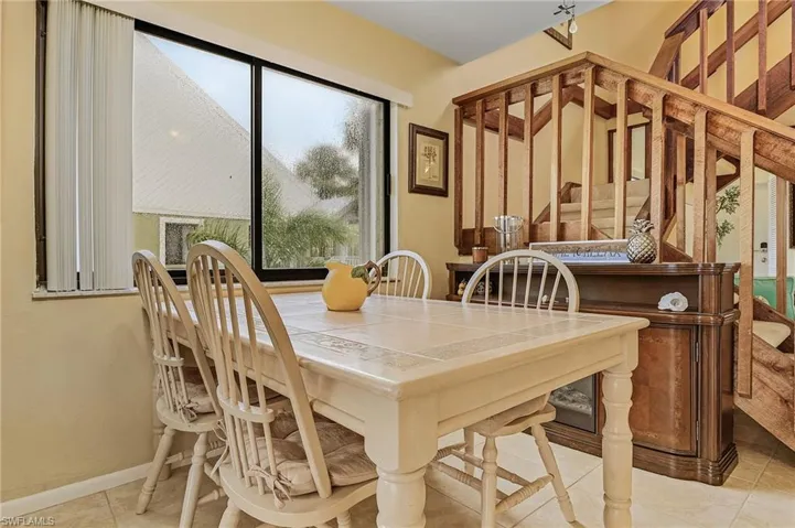 Tiled dining area with baseboards