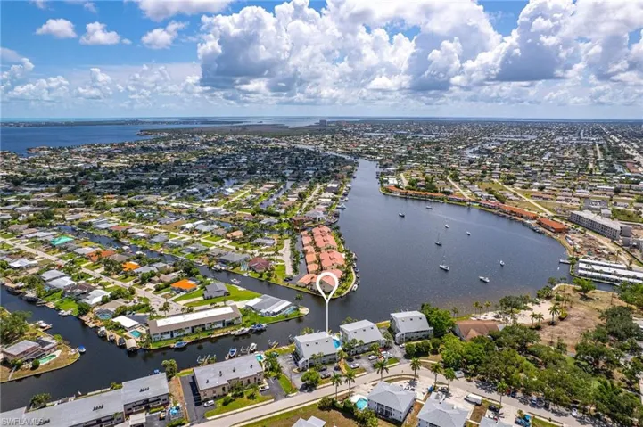 Drone / aerial view with a residential view and a water view