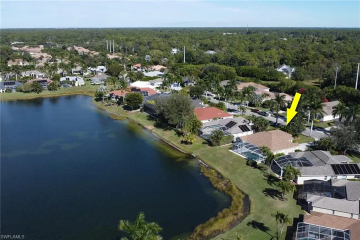 View of property location featuring a nearby body of water and nearby suburban area