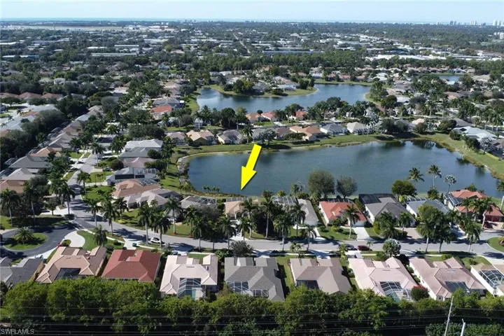 Aerial overview of property's location featuring nearby suburban area and a large body of water