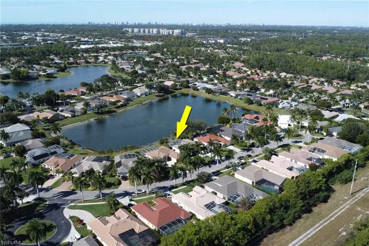 View of property location with a large body of water and nearby suburban area
