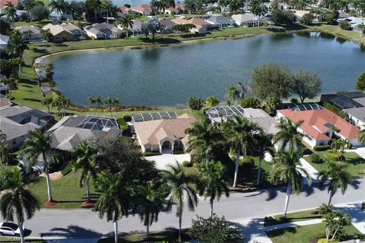 View of property location with a large body of water and nearby suburban area
