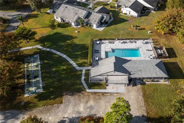 Aerial view of residential area featuring a pool area