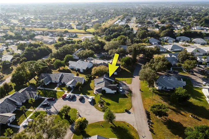 Aerial view of property's location featuring nearby suburban area