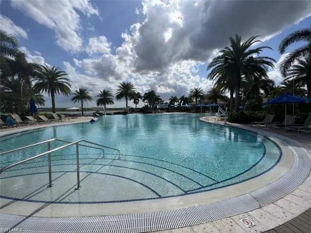 Community lounge pool with a patio area