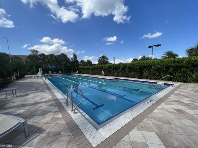 Community lap pool with a patio