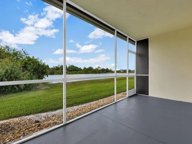 Screened lanai offering beautiful views of the community lake and surrounding natural areas.