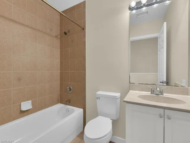 This well-appointed hall bathroom offers exceptional convenience and functionality, making it an ideal space for guests and residents alike, ensuring a comfortable and welcoming experience for everyone.