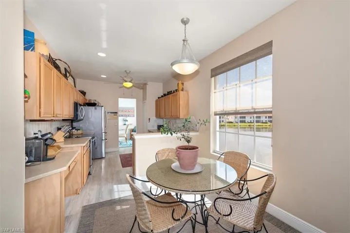 Dining space featuring recessed lighting, ceiling fan, and light wood-style floors