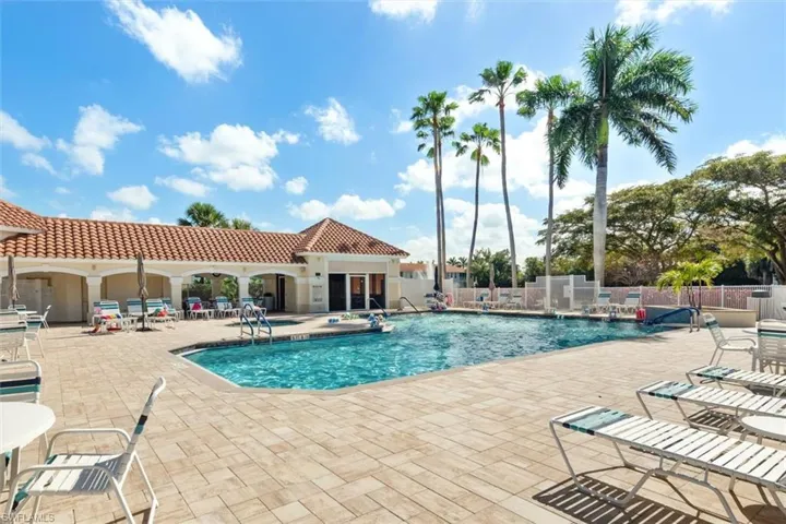 Community pool featuring a patio