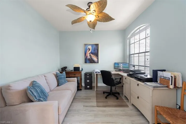 Office space with ceiling fan and light wood finished floors