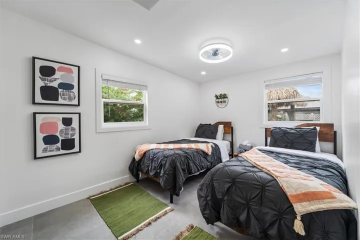 Bedroom featuring multiple windows