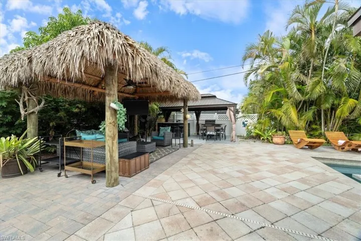 View of patio with a gazebo and an outdoor living space
