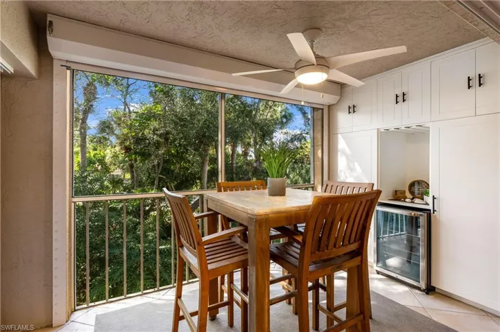 Sunroom featuring wine cooler