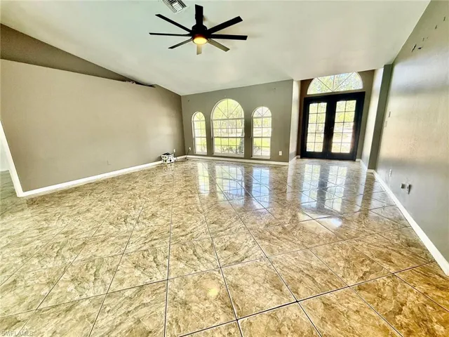 Unfurnished bedroom featuring ceiling fan and a closet