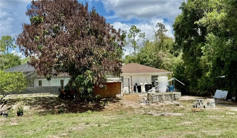 Rear view of property featuring a patio area