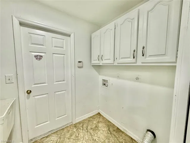 Laundry area with hookup for a washing machine and cabinet space