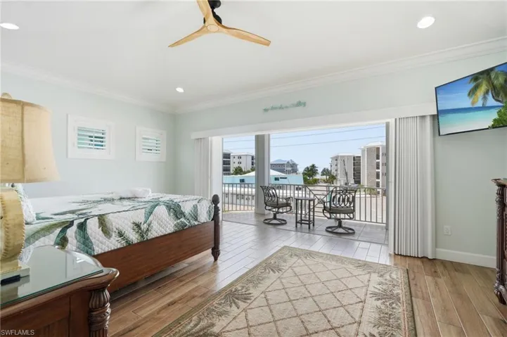 Hardwood-finish flooring, recessed lighting, and a modern ceiling fan - Virtually Edited Image