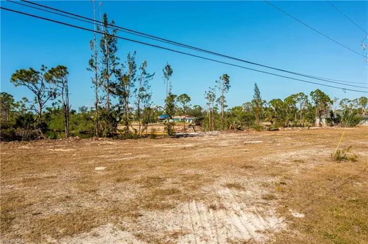 Looking at the lot from the road toward the back and canals.