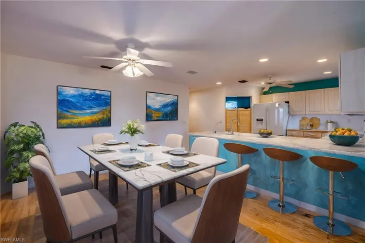 Virtually staged. Kitchen is open to the breakfast nook and features a breakfast bar and french doors to the Private Courtyard.