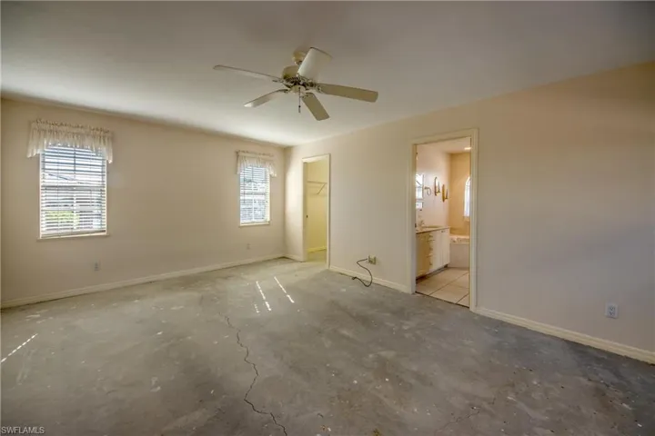 Primary Suite is spacious enough for a sitting area and features a huge walk-in closet and an en-suite bathroom. Offers windows to the canal and to the huge courtyard and french doors to the courtyard.