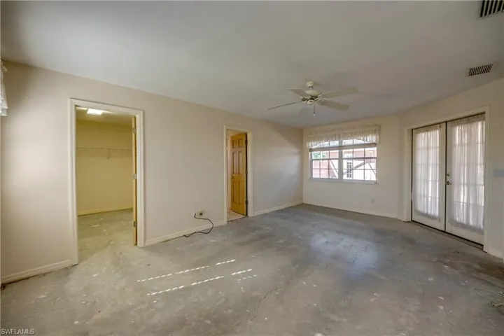 Primary Suite is spacious enough for a sitting area and features a huge walk-in closet and an en-suite bathroom. Offers windows to the canal and to the huge courtyard and french doors to the courtyard.
