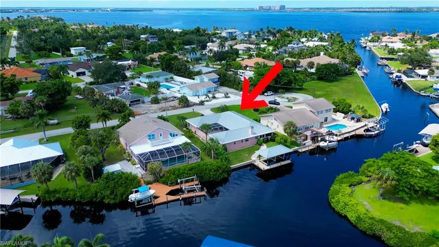 LOCATION, LOCATION, LOCATION! Great opportunity to own a Quick Direct Gulf Access Home in the Popular Iona McGregor Area! Main Canal Frontage and Intersecting Canal Views! Quite Cul-de-sac Street and only 9 Homes to the River! Courtyard Style home built in 1996 with a Metal roof and 2,020 Sq Ft of Living area.  Brick Paver Walkway leading to the Large walk around Dock with a Covered Boat Lift.