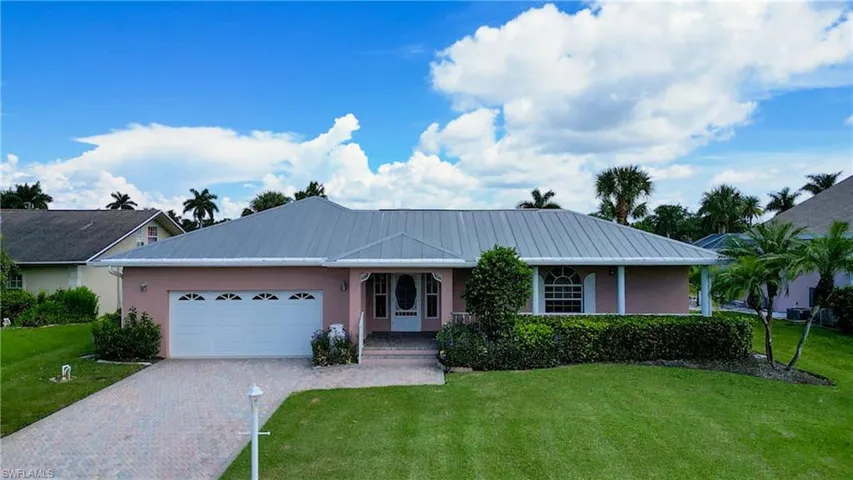 Quite Cul-de-sac Street in Popular Iona McGregor Area and only 9 Homes to the River! Courtyard Style Direct Gulf Access home built in 1996 with a Metal roof and 2,020 Sq Ft of Living area. 3 Bedrooms and 3 baths with an oversized 2 car garage and Boat Dock and Lift!