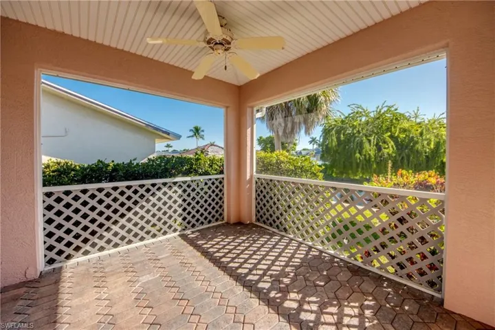Lanai in the back of home features brick pavers and is under truss and screened. Back screened door leads to brick pavered walkway and on to the Dock and boat lift!
