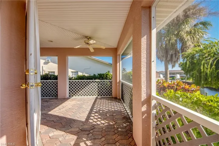 Lanai in the back of home features brick pavers and is under truss and screened. Back screened door leads to brick pavered walkway and on to the Dock and boat lift!