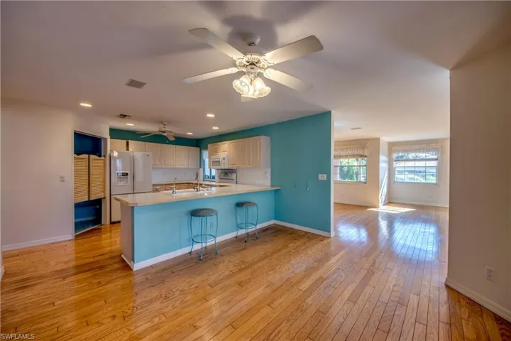 Kitchen is open to the breakfast nook and features a breakfast bar and french doors to the Private Courtyard. Breakfast Nook flows to the Great room.