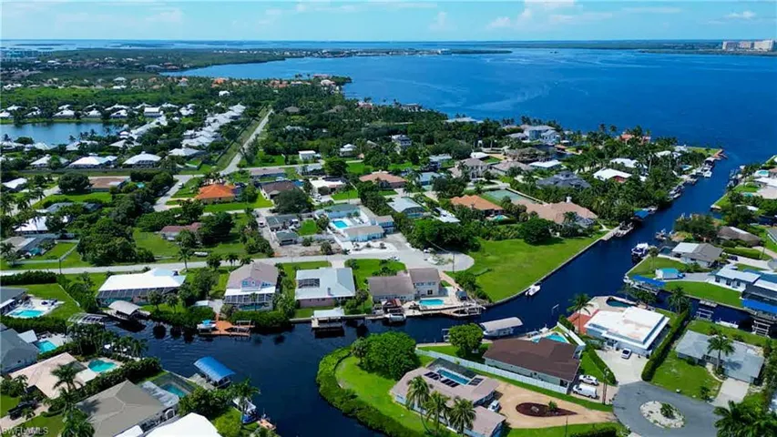 Aerial view to West showing the Caloosahatchee Intracoastal Waterway and on to the gulf! Boating access to wonderful waterfront restaurants in Cape Coral, Sanibel, Fort Myers Beach, Downtown Fort Myers, Saint James City, Pine Island, Cabbage Key, Captiva Island, North Captiva Island and more! Enjoy boating to barrier islands for shelling or go Dolphin and Manatee watching. Enjoy fishing the many inland waterways or offshore for the Avid Angler!