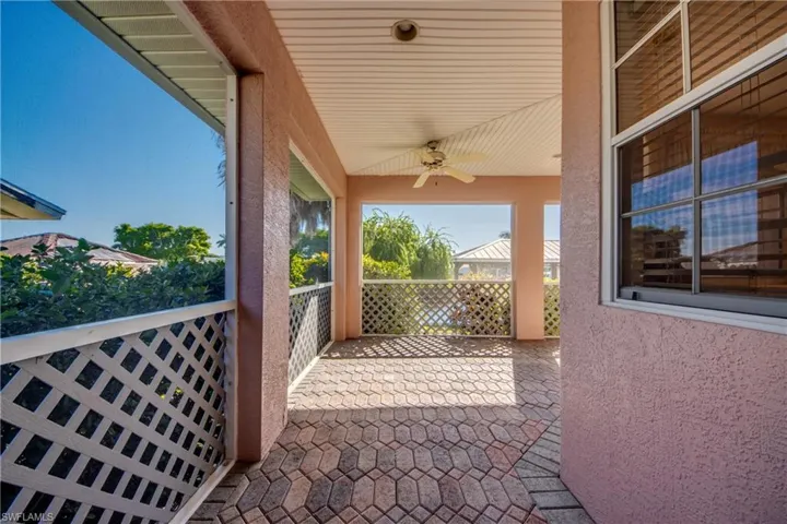 Lanai in the back of home features brick pavers and is under truss and screened. Back screened door leads to brick pavered walkway and on to the Dock and boat lift!