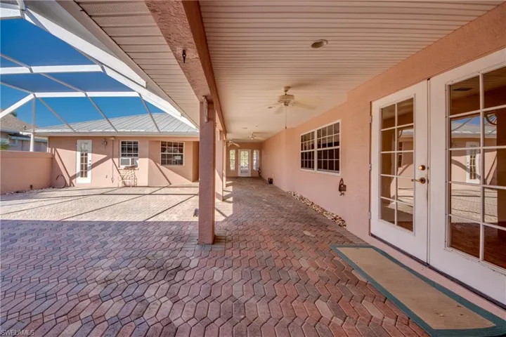 Huge Private Brick paver Courtyard with covered and open screened sitting areas! Offers entry to the Cabana Guest Suite and the main home!