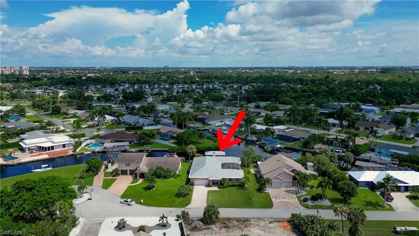 Aerial view of home shows intersecting Canals. Boating access to wonderful waterfront restaurants in Cape Coral, Sanibel, Fort Myers Beach, Downtown Fort Myers, Saint James City, Pine Island, Cabbage Key, Captiva Island, North Captiva Island and more! Enjoy boating to barrier islands for shelling or go Dolphin and Manatee watching. Enjoy fishing the many inland waterways or offshore for the Avid Angler!