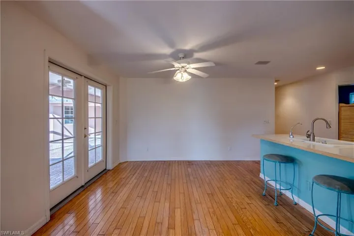 Kitchen is open to the breakfast nook and features a breakfast bar and french doors to the Private Courtyard.