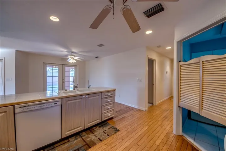 Kitchen is open to the breakfast nook and features a serving window to the covered and screened Lanai. There is a Laundry room off the kitchen that has ample space for a pantry. The hallway to the right leads to the second bedroom, a full guest bathroom and the oversized 2 car garage!