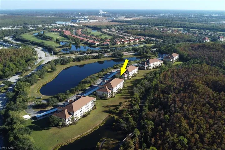 Aerial view of property's location featuring a nearby body of water