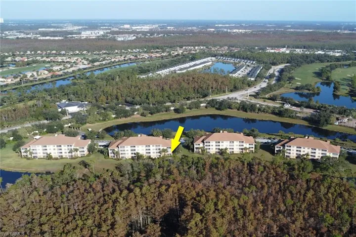 Aerial overview of property's location with a nearby body of water